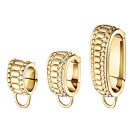 Set of three gold hoop earrings with a textured design featuring small, rounded beads in varying sizes.