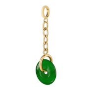 A serene green jade charm styled as a pendant for beach layering.